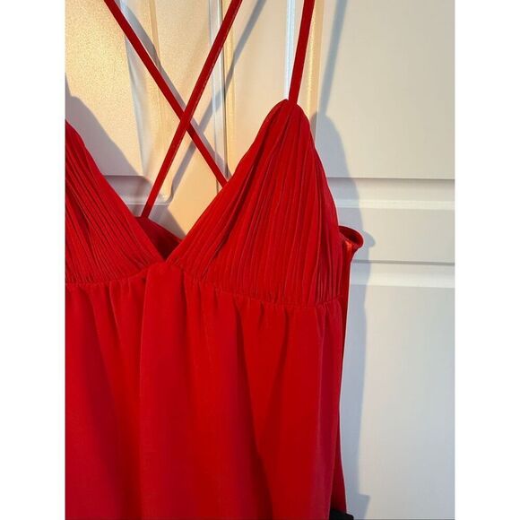 Spaghetti strap chiffon baby doll dress with a v-neckline, crisscross back, and - Picture 5 of 10